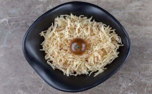bowl-grated-pasta-with-tomato-marble-surface_114579-63821