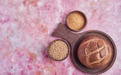 bread-bun-blended-wheat-pink-table_114579-19883
