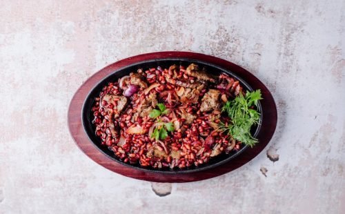 meat-stew-with-spices-herbs-inside-black-pan_114579-3345