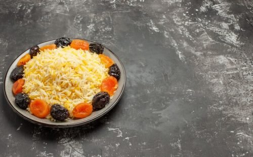 side-close-up-view-rice-rice-with-dried-fruits-plate_140725-74068